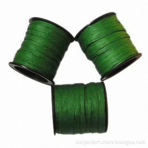 Paper raffia ribbon on plastic spool, various colors are available